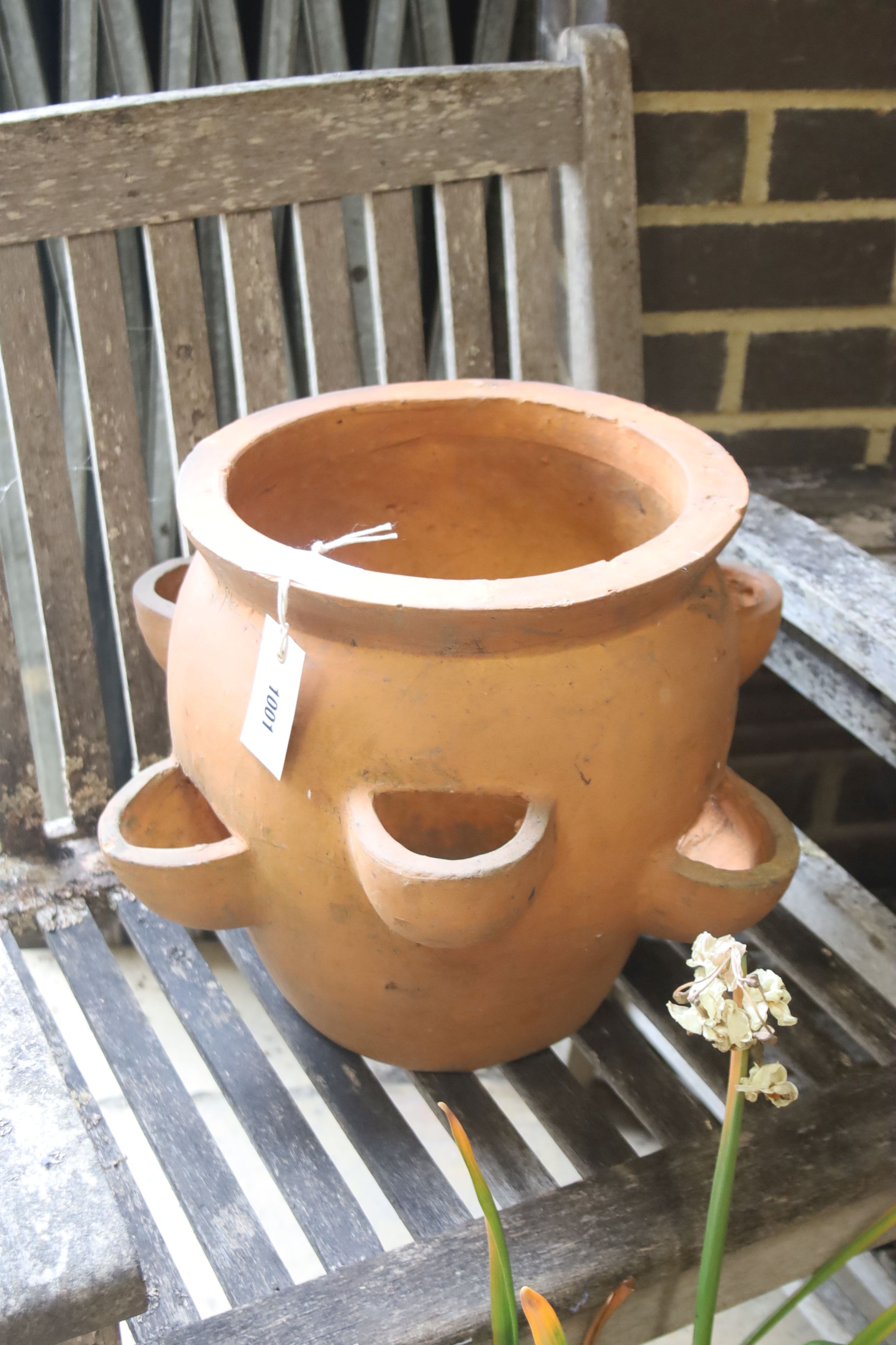 A pair of terracotta garden planters, 40cm diameter, height 32cm